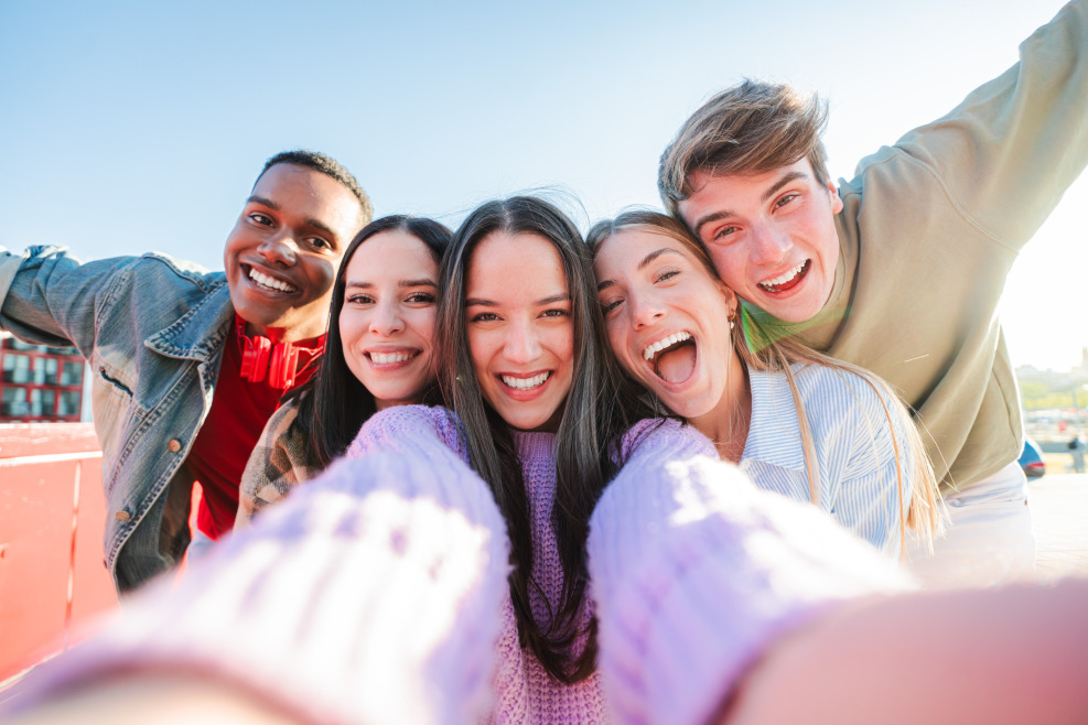 Group of happy professionals celebrating teamwork and success, representing the rewarding opportunities available in ABA careers for those passionate about helping others.