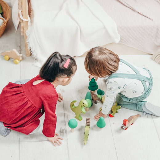 Two young children engaging in cooperative play during ABA therapy in Chattanooga, developing social skills, communication, and teamwork in a structured learning environment.